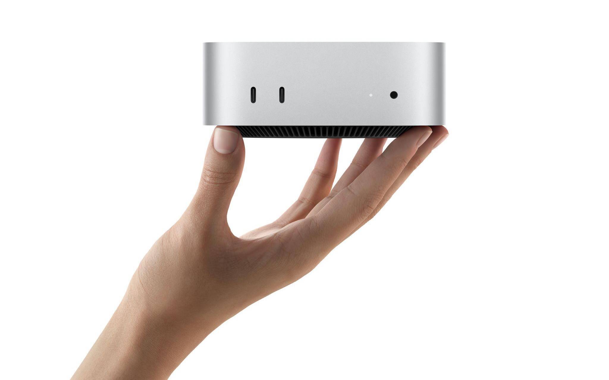 Der neue Apple Mac mini in einer Hand
